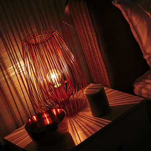 Wire lamp shade casting shadows